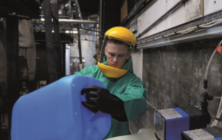 Chemical solution being poured into a boiler system